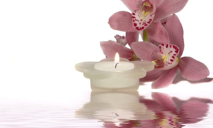 reflected orchid and candle